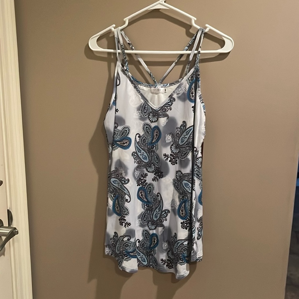 Never been worn, spaghetti strap blouse, criss cross straps in back size medium